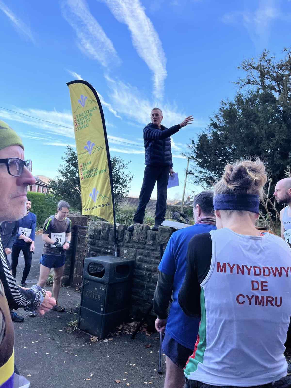 Runners listening to the start-line briefing